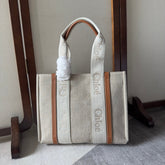 MEDIUM WOODY TOTE BAG 37 IN BEIGE LINEN CANVAS WEBBING LOGO EMBROIDERY BROWN CALFSKIN