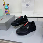 PRADA 25S CROSS LACED SNEAKERS IN BLACK CALFSKIN