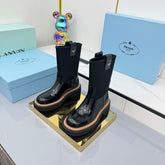 PRADA 25S HIGH MARTIN BOOTS 50MM IN BLACK GLOSSY CALFSKIN