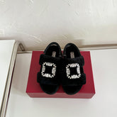 SLIDY VIV' WINTER FUR STRASS BUCKLE SANDALS IN BLACK SHEARLING
