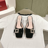 CRYSTAL HEEL MULE IN BLACK PATENT CALFSKIN WITH EMBELLISHED BUCKLE