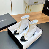 CHANEL 25S HEELED CHAIN BOOTS WITH BOW IN WHITE CALFSKIN GOLD HARDWARE