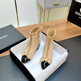 CHANEL 25S HEELED CHAIN BOOTS WITH BOW IN BEIGE CALFSKIN GOLD HARDWARE