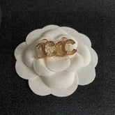 DOUBLE C STUD EARRINGS IN GOLD METAL FULLY DIAMOND