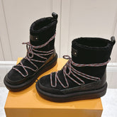 ASPEN PLATFORM ANKLE BOOT IN BLACK MONOGRAM DEBOSSED SUEDE AND SHEARLING