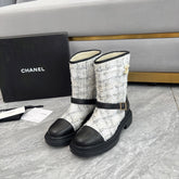 CHANEL 25S MID-CALF BOOTS 45MM IN BLACK CALFSKIN AND WHITE TWEED GOLD HARDWARE