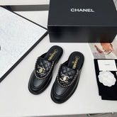 CHANEL 25S MULES WITH CHAIN DETAIL IN BLACK CALFSKIN GOLD HARDWARE