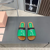 SLIPPERS IN GREEN GLOSSY CALFSKIN WITH BLACK HALF-FOOT SOCKS
