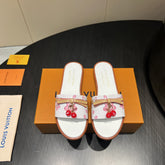 LV SLIDE SANDALS 25S IN WHITE CALFSKIN WITH CHERRY BLOSSOM BUCKLE