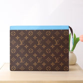 LV 25S POCHETTE VOYAGE 26 IN GASTON BLUE MONOGRAM MACASSAR COATED CANVAS