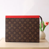 LV 25S POCHETTE VOYAGE 26 IN SARI RED MONOGRAM MACASSAR COATED CANVAS