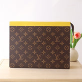 LV 25S POCHETTE VOYAGE 26 IN YELLOW MONOGRAM MACASSAR COATED CANVAS