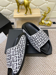 BALMAIN 25S BALMAIN MULES IN BLACK AND WHITE CALFSKIN