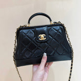MEDIUM TOP HANDLE BAG 23 IN BLACK OIL-WAX LAMBSKIN GOLD HARDWARE