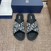 DIOR 25S ALIAS CROSS-STRAP SLIDES IN BLACK CALFSKIN WITH CD OBLIQUE DEEP BLUE LOGO