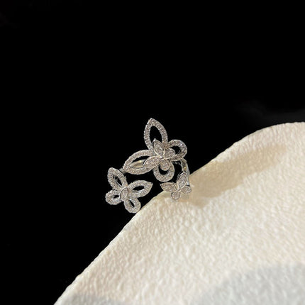 TRIPLE BUTTERFLY SILHOUETTE SILVER DIAMOND RING