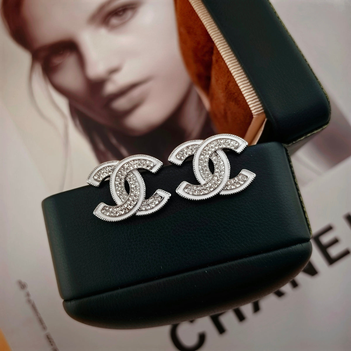 DOUBLE C STUD EARRINGS WITH WHITE TRIM AND CLEAR STONE LOGO